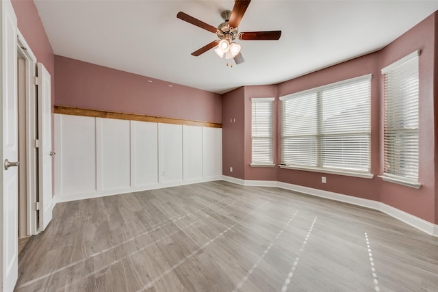 interior space with ceiling fan