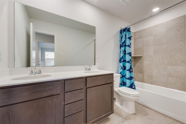 full bathroom featuring tile patterned flooring, vanity, toilet, and shower / bath combo with shower curtain