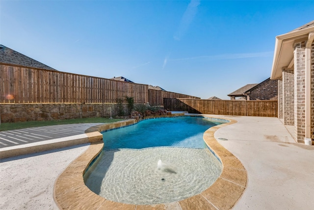 view of pool featuring pool water feature and a patio area