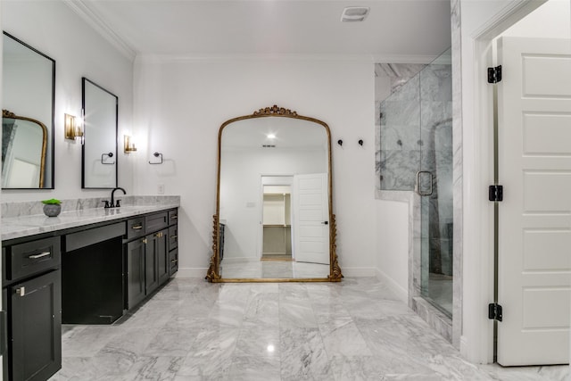 bathroom with vanity, a shower with door, and crown molding