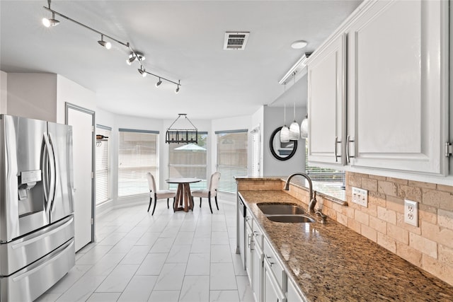 kitchen featuring white cabinetry, sink, and appliances with stainless steel finishes