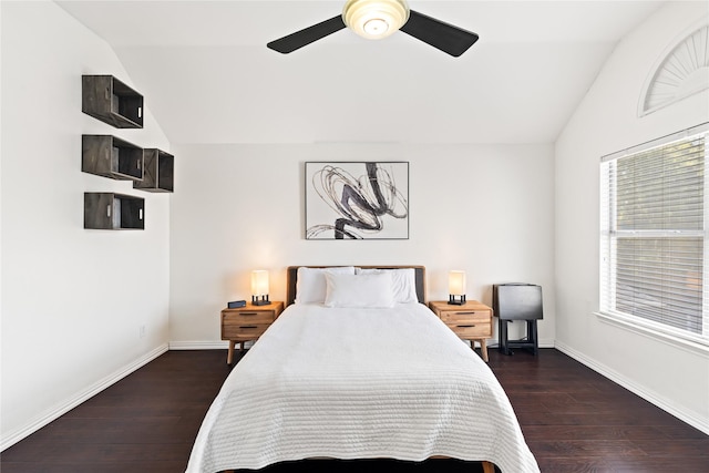 bedroom featuring ceiling fan, dark hardwood / wood-style flooring, and lofted ceiling