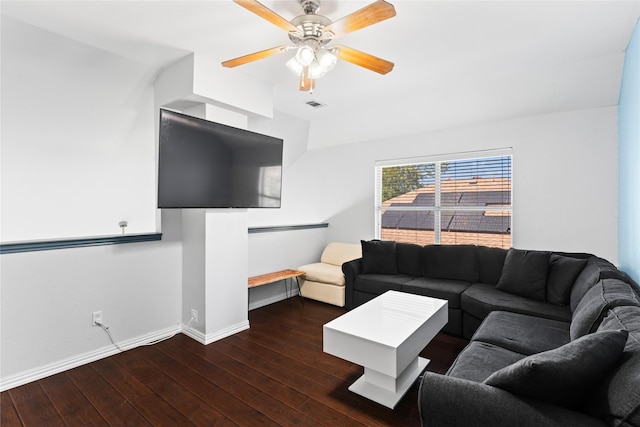 living room with ceiling fan and dark wood-type flooring