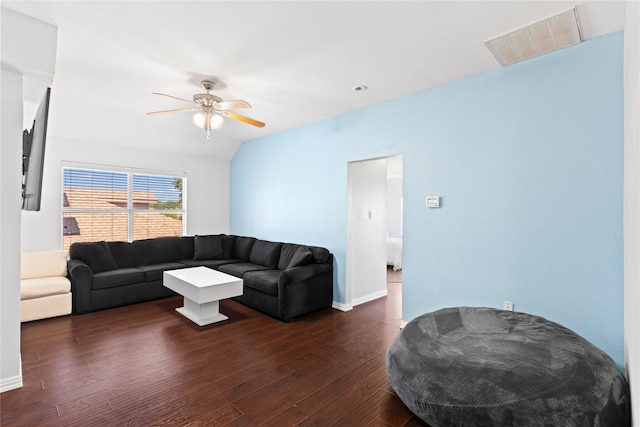 living room with ceiling fan, lofted ceiling, and dark wood-type flooring