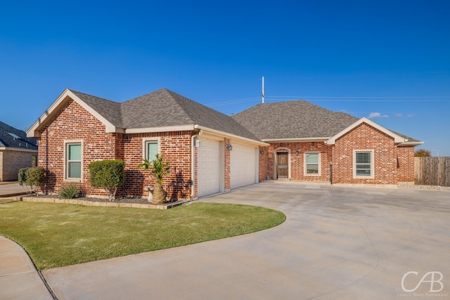 single story home with a front lawn and a garage