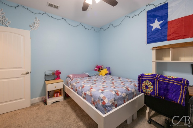 bedroom featuring ceiling fan and carpet