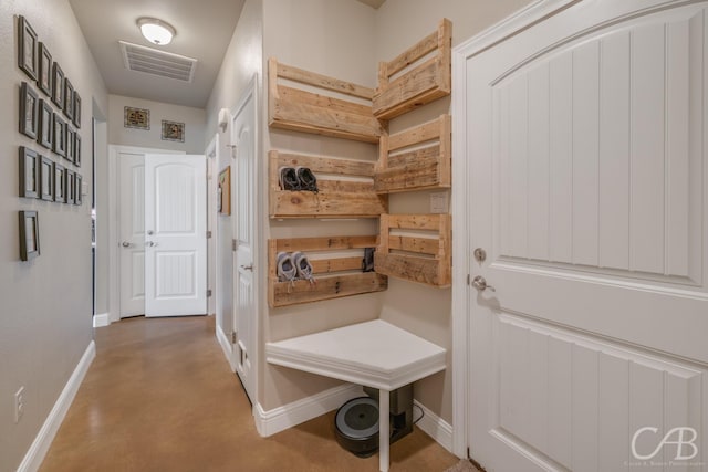 mudroom with concrete flooring