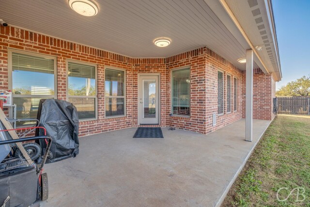 view of patio featuring a grill