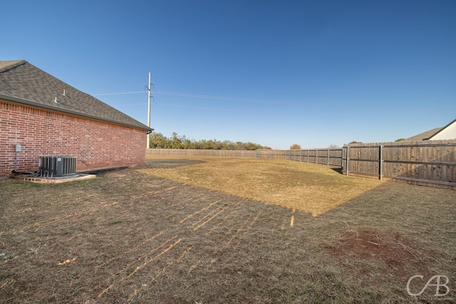 view of yard featuring central AC