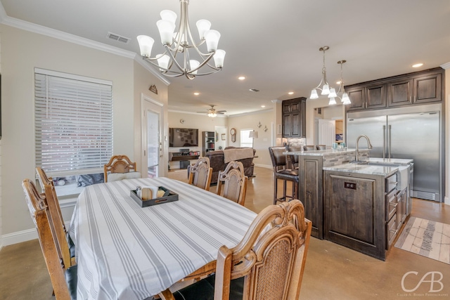 dining area featuring ceiling fan with notable chandelier and crown molding