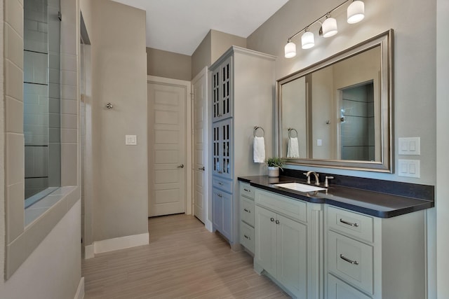 bathroom featuring hardwood / wood-style floors and vanity