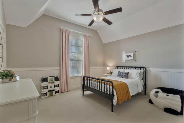 carpeted bedroom featuring ceiling fan and lofted ceiling