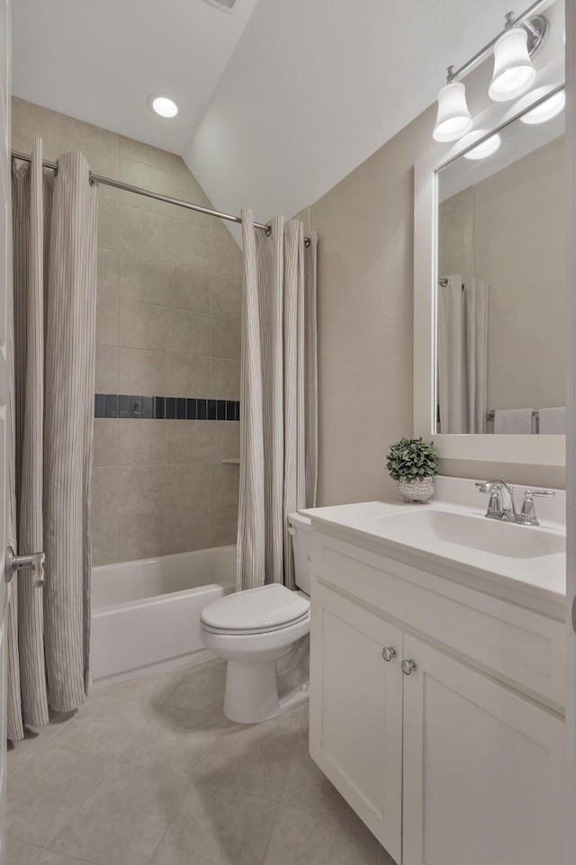 full bathroom featuring vanity, tile patterned floors, shower / bath combination with curtain, and toilet