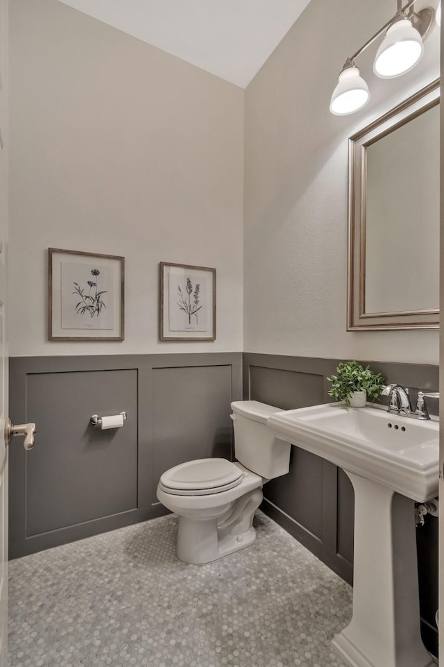 bathroom with sink, tile patterned floors, and toilet