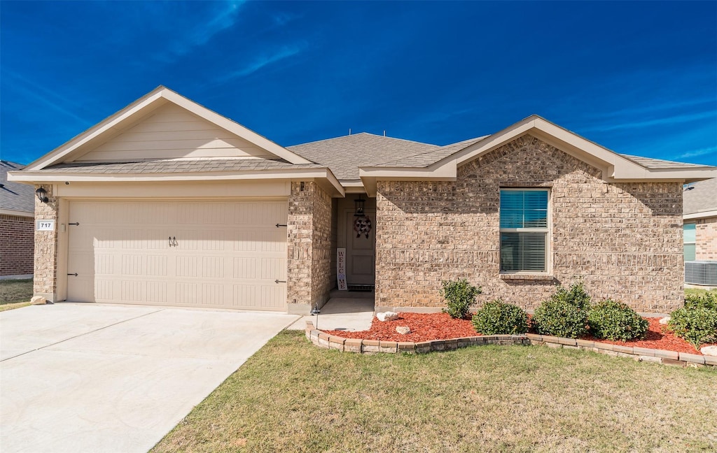 ranch-style home featuring a garage and a front yard