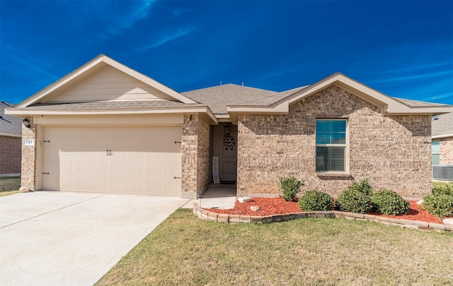 ranch-style home featuring a garage and a front yard