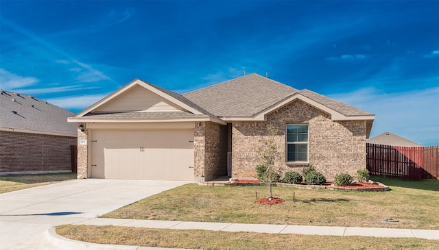 ranch-style house with a garage and a front yard