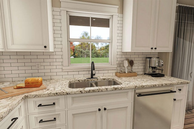 kitchen with dishwasher, sink, light stone counters, decorative backsplash, and white cabinets