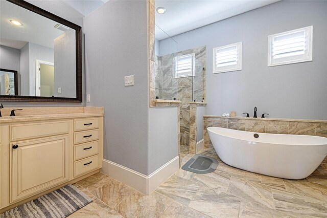 bathroom featuring vanity and plus walk in shower