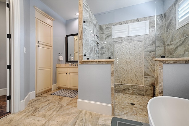 bathroom with vanity and independent shower and bath