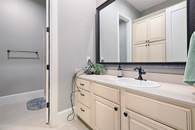 bathroom with tile patterned flooring and vanity