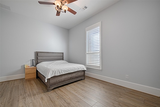 bedroom with light wood-type flooring and ceiling fan