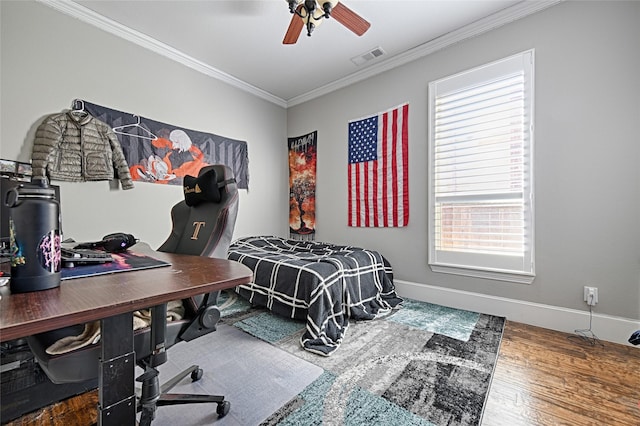 bedroom with ceiling fan, wood-type flooring, and ornamental molding