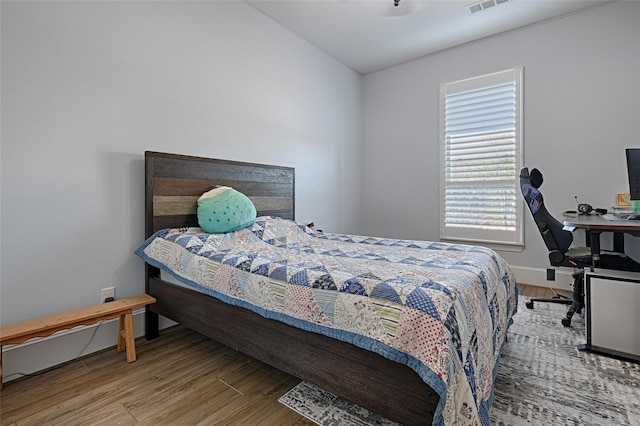 bedroom with wood-type flooring