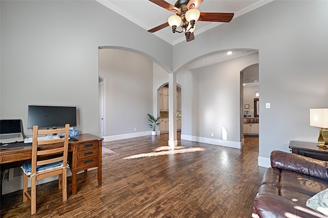 office featuring ceiling fan, crown molding, and dark wood-type flooring