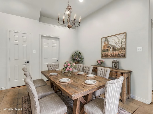 dining area with baseboards, light tile patterned floors, and an inviting chandelier