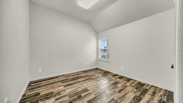 914 Randall Rd, Weatherford, TX 76087 - unfurnished room with baseboards, lofted ceiling, and dark wood-style flooring