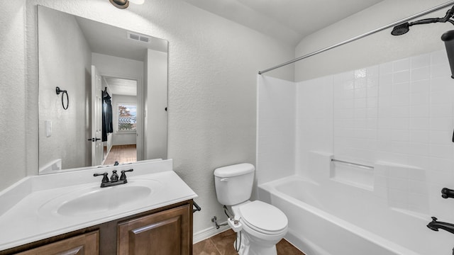 full bathroom featuring shower / bath combination, visible vents, a textured wall, toilet, and vanity