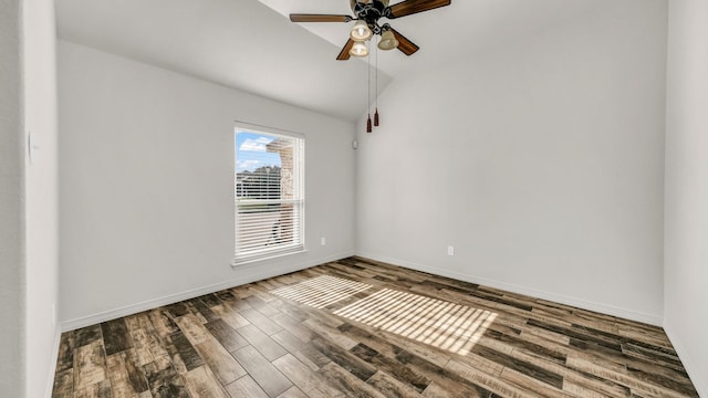 empty room with ceiling fan, lofted ceiling, and hardwood / wood-style flooring