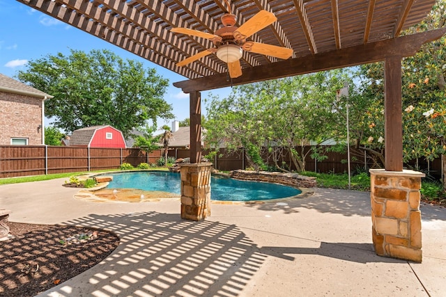 view of swimming pool with ceiling fan, a patio area, and a pergola