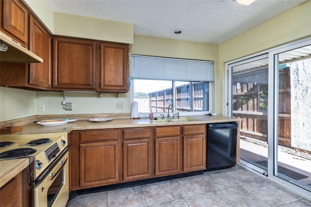 kitchen featuring light tile patterned flooring, black dishwasher, sink, electric range, and a textured ceiling