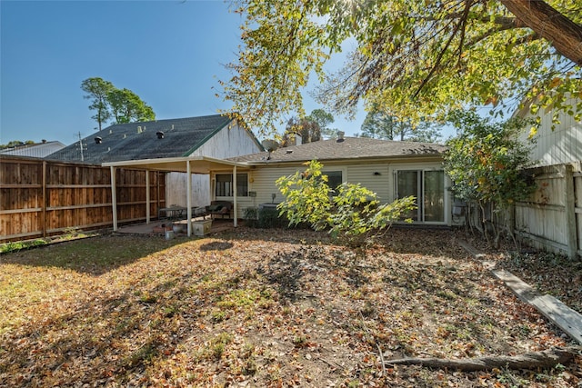 rear view of house featuring a patio