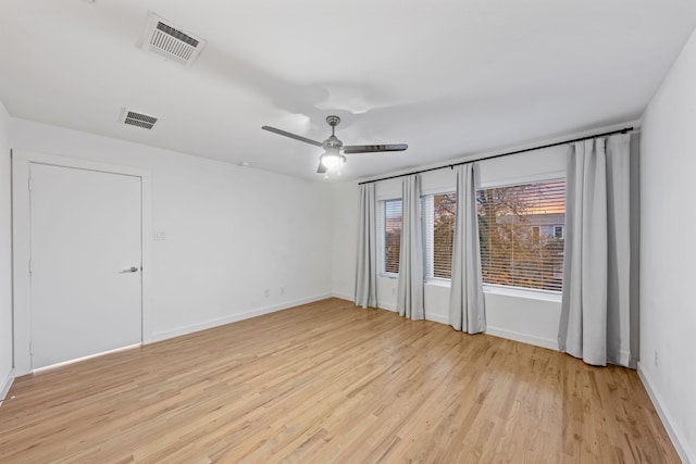 spare room featuring ceiling fan and light hardwood / wood-style floors