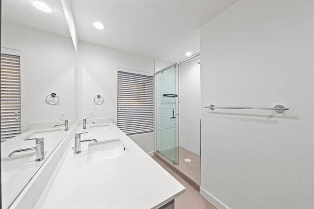 bathroom with vanity and an enclosed shower