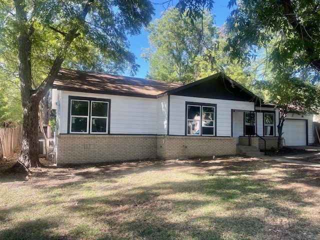 3914 Menn St, Haltom City, TX 76117 - view of front of home featuring brick siding and a garage