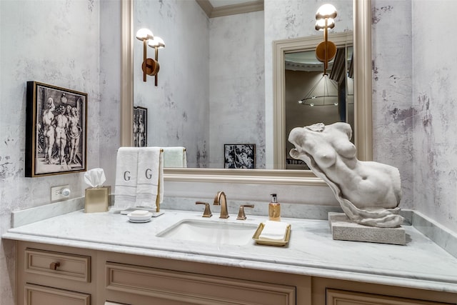 bathroom with vanity and ornamental molding