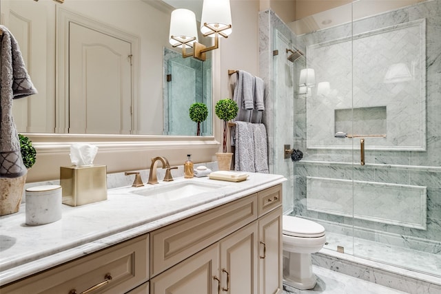 bathroom with a shower with door, vanity, and toilet