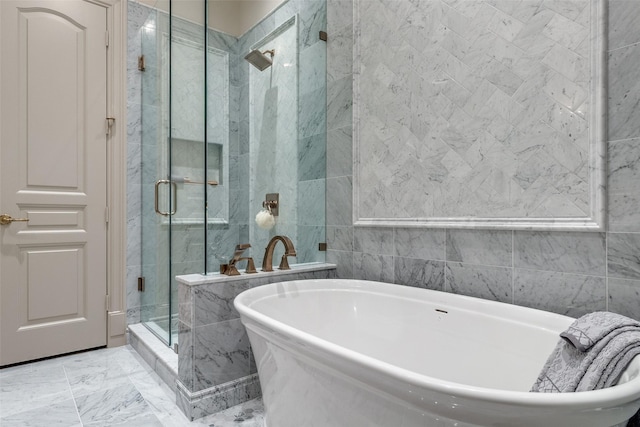 bathroom featuring separate shower and tub and tile walls