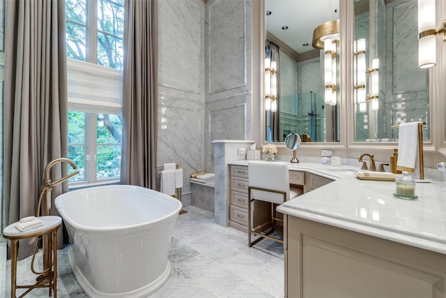 bathroom with vanity, crown molding, and a bath