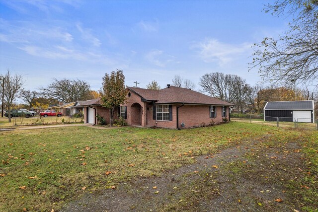 ranch-style home with a front yard and a garage