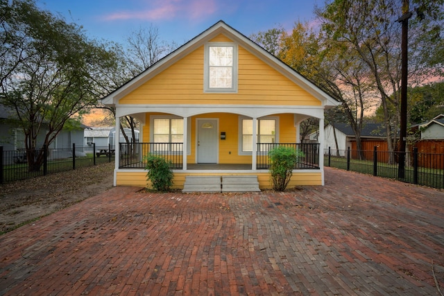 bungalow-style home with covered porch