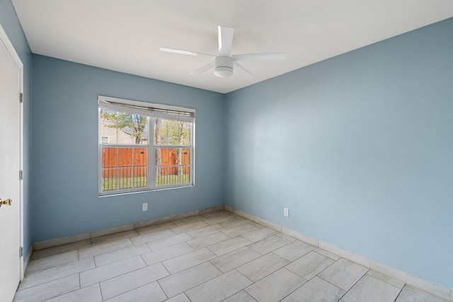 spare room featuring ceiling fan