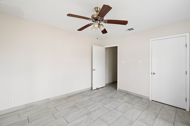 unfurnished bedroom featuring ceiling fan