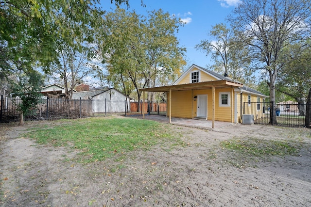 back of house featuring central AC unit