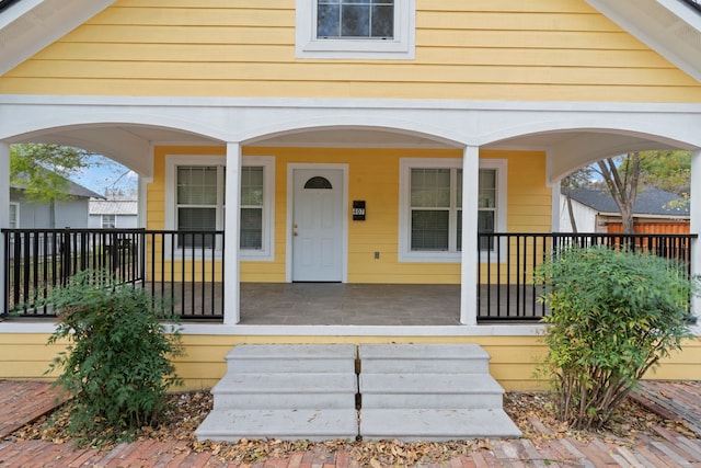 entrance to property with a porch