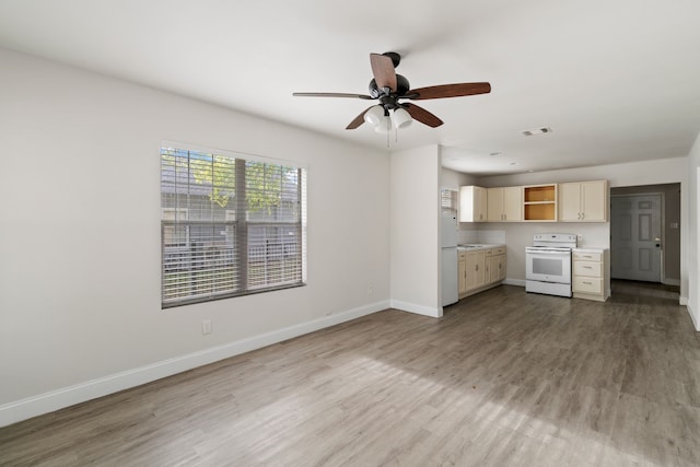 kitchen featuring white appliances, light hardwood / wood-style floors, and ceiling fan